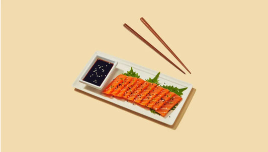 Cruelty-free seafood products displayed as vegan sashimi slices with soy sauce and sesame seeds.
