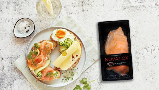 Sustainably-raised salmon featured as nova lox with gourmet bagel toppings and a packaged fillet on the side.
