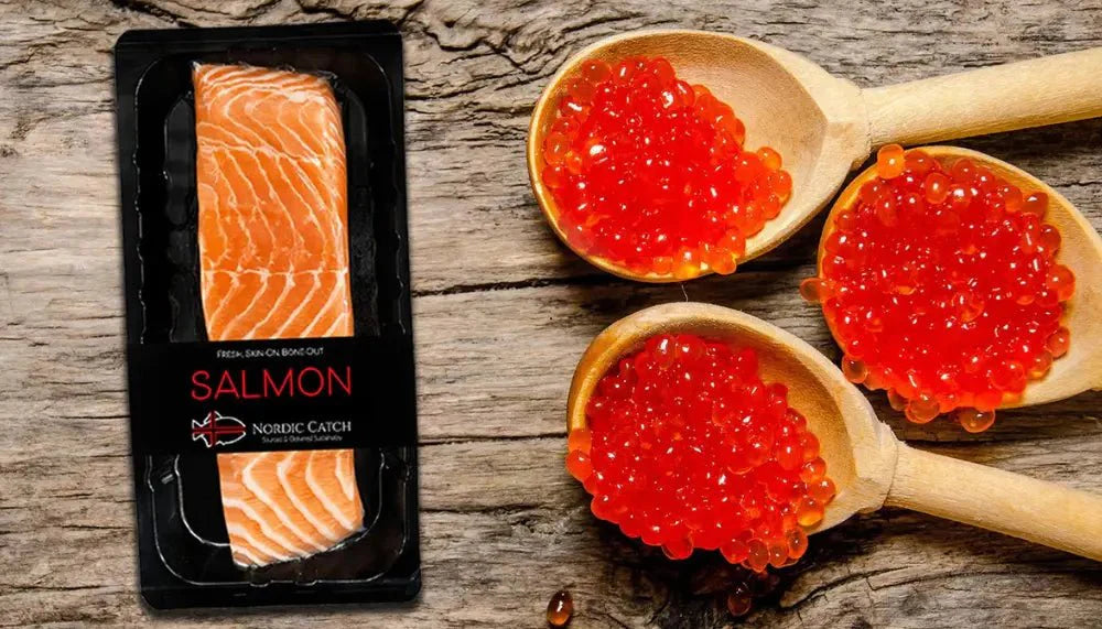 Seafood delivery featuring packaged fresh salmon fillet and wooden spoons filled with vibrant orange salmon roe.