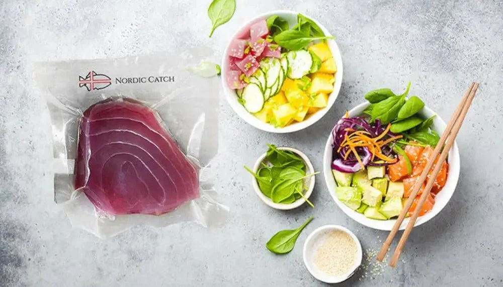 Naturally caught tuna packaged by Nordic Catch next to colorful poke bowls with fresh vegetables.