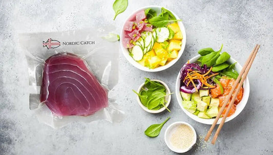 Naturally caught tuna packaged by Nordic Catch next to colorful poke bowls with fresh vegetables.