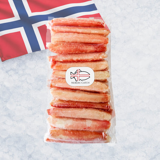 Snow crab legs without a shell on a bed of ice with a Norwegian flag in the background