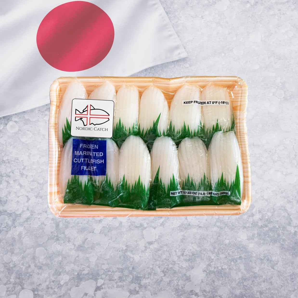 Frozen marinated cuttlefish fillet package with white fillets on green grass bed and Japanese flag on crushed ice background