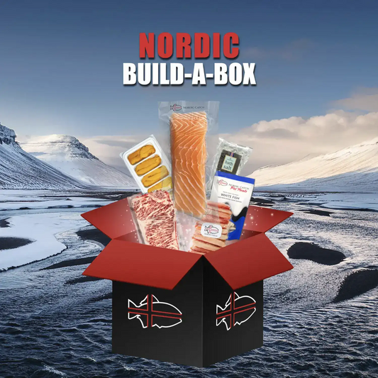 Meat and seafood box featuring Icelandic salmon, white fish, cured meats, smoked seafood, sea salt, and potato slices displayed in an open red and black box against a snowy mountain landscape