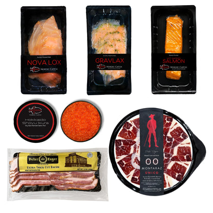 Premium seafood collection with Nordic Catch Novalox smoked salmon, Gravlax cured salmon, hot-smoked salmon, Hokkaido Shoyu Ikura salmon roe, Peter Luger bacon, and Montaraz Unico Iberico ham