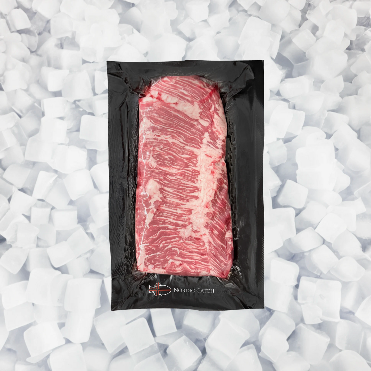 A vacuum-sealed raw cut of marbled skirt steak in a black package, centered on a bed of white ice cubes. The package shows the brand name 'NORDIC CATCH' at the bottom.