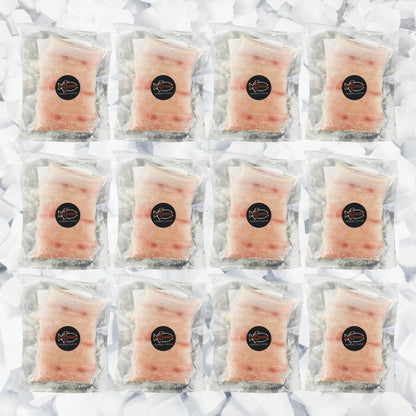 Multiple packages of Mahi Mahi raw fish with a brand logo on a white background